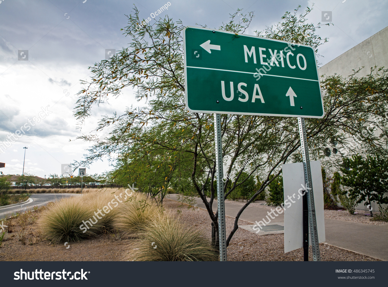 Signpost at the US-Mexican border #486345745