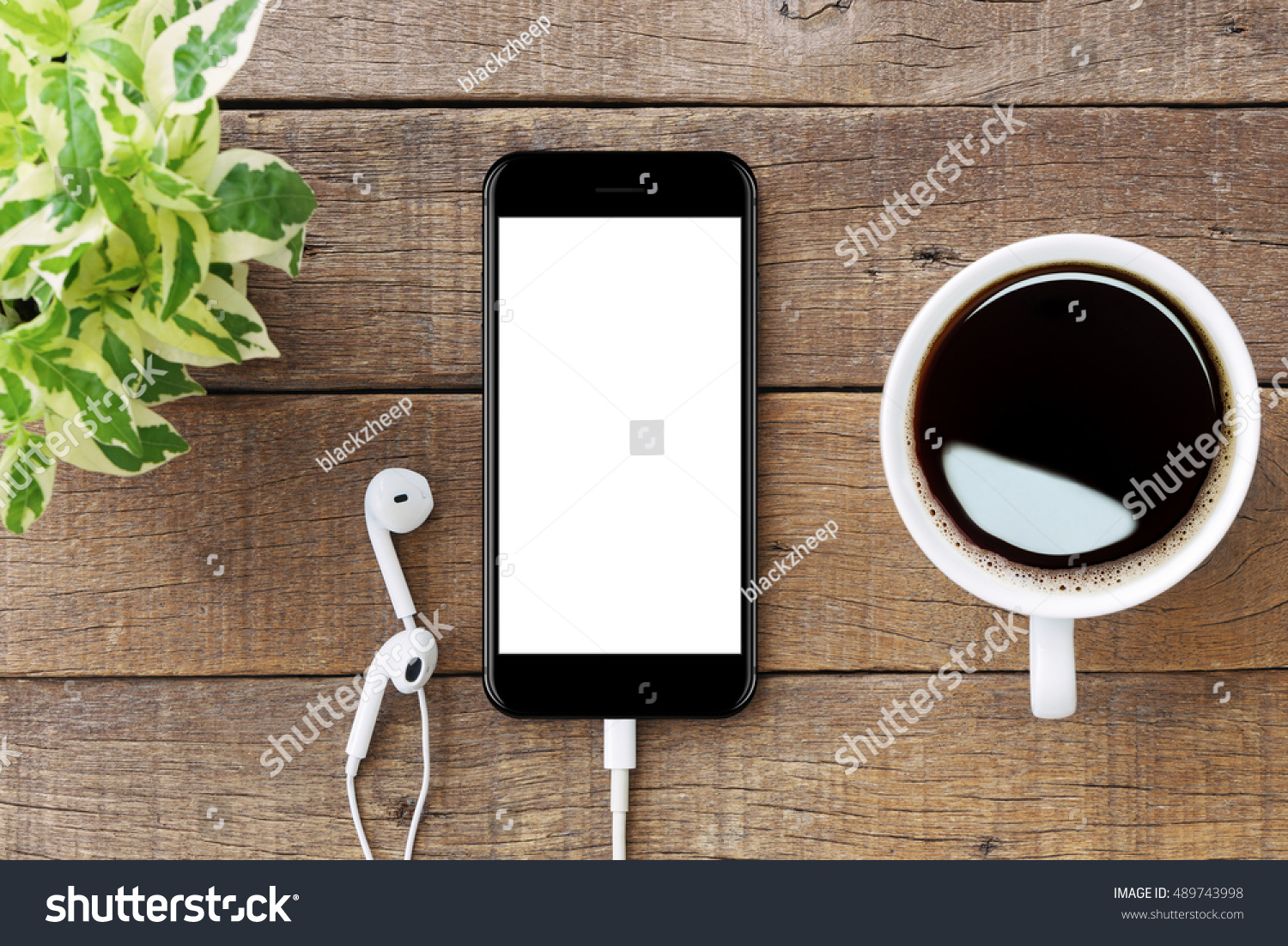 smartphone white screen on wooden table, mockup modern smartphone jet black color #489743998