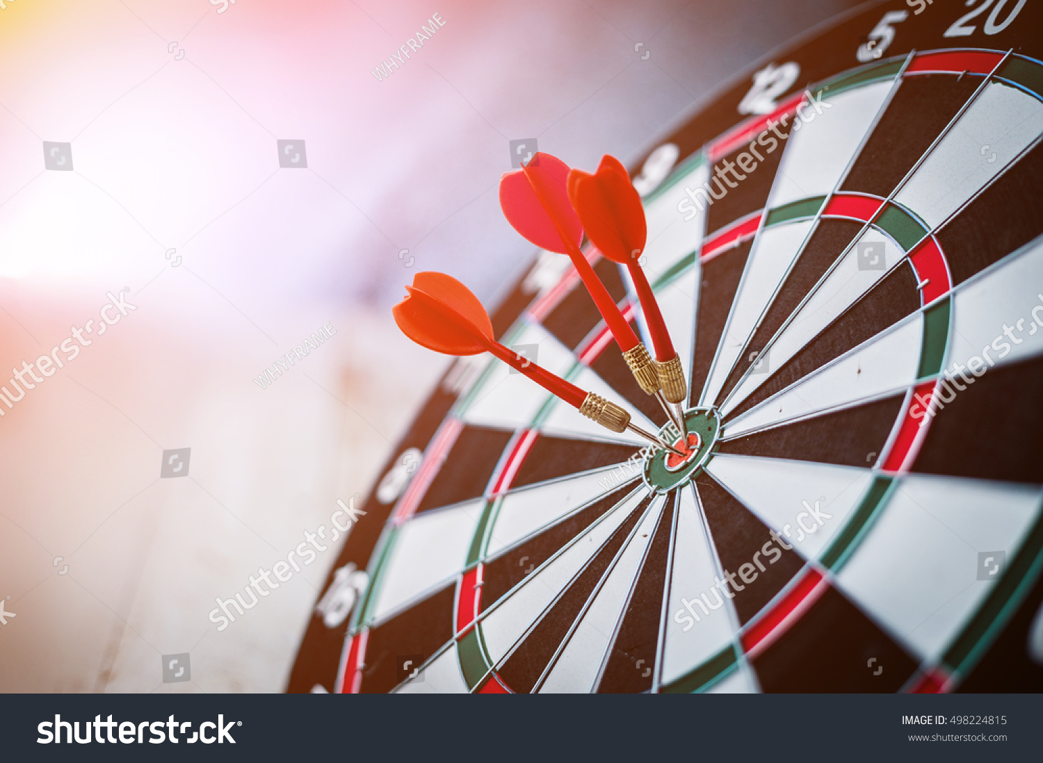 red three darts arrows in the target center business goal concept #498224815
