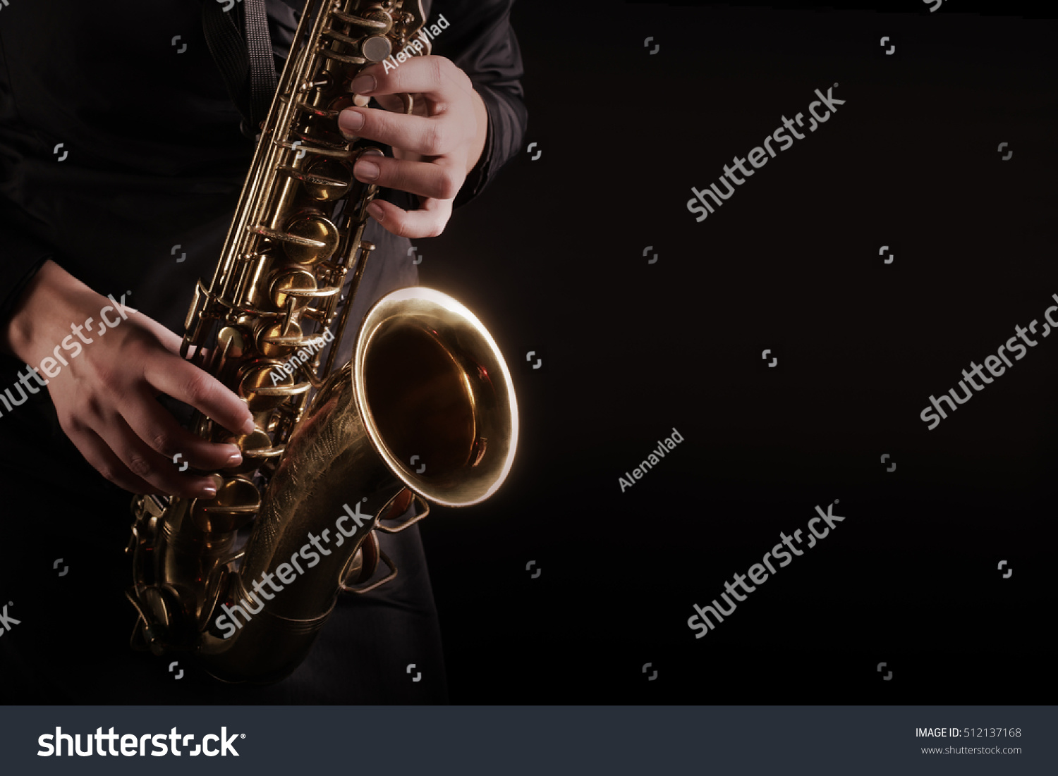 Saxophone Player hands Saxophonist playing jazz music. Alto sax musical instrument closeup #512137168