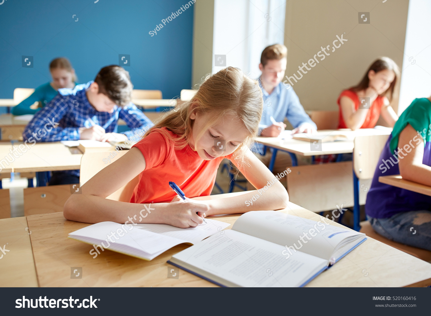 education, learning and people concept - student girl with book writing school test #520160416
