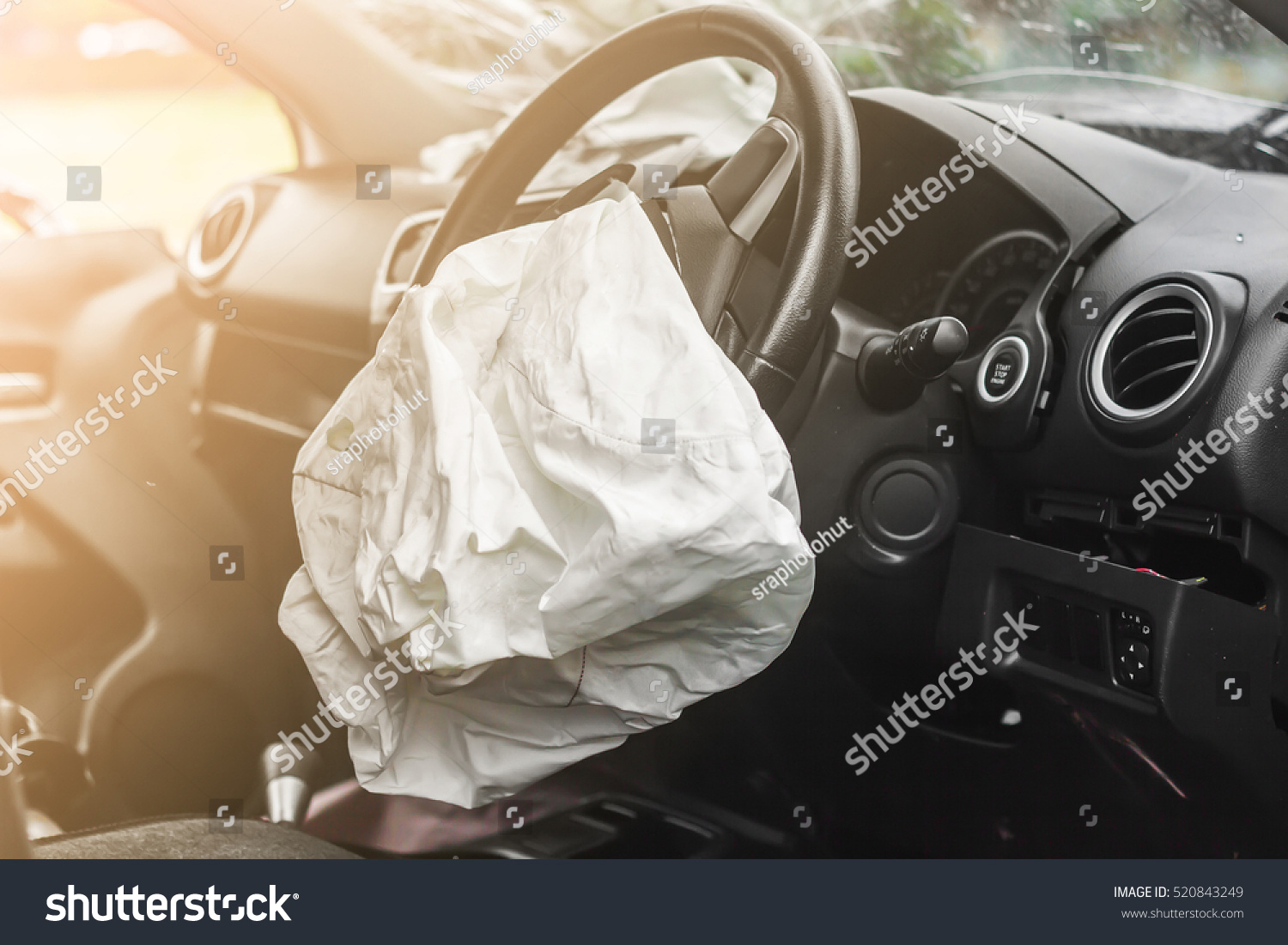 Airbag exploded at a car accident with illuminated #520843249