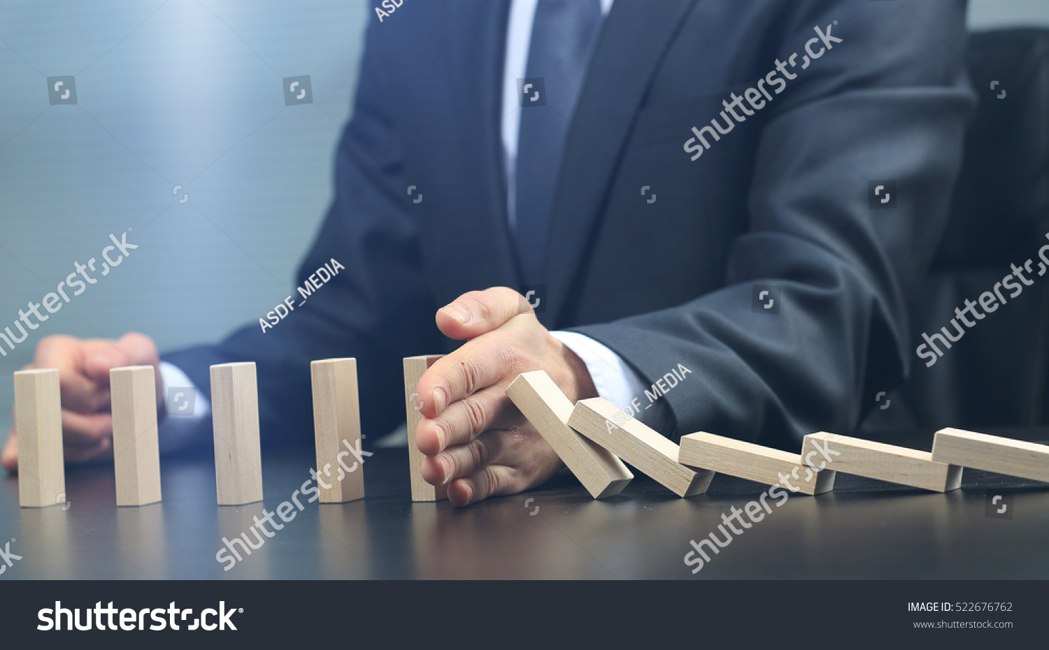 male hand placing wooden block on a tower. planing and strategy concept #522676762