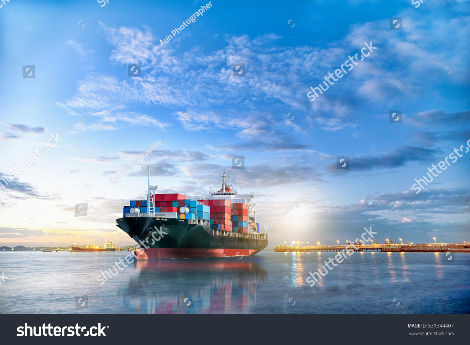 Logistics and transportation of International Container Cargo ship in the ocean at twilight sky, Freight Transportation, Shipping #531344407