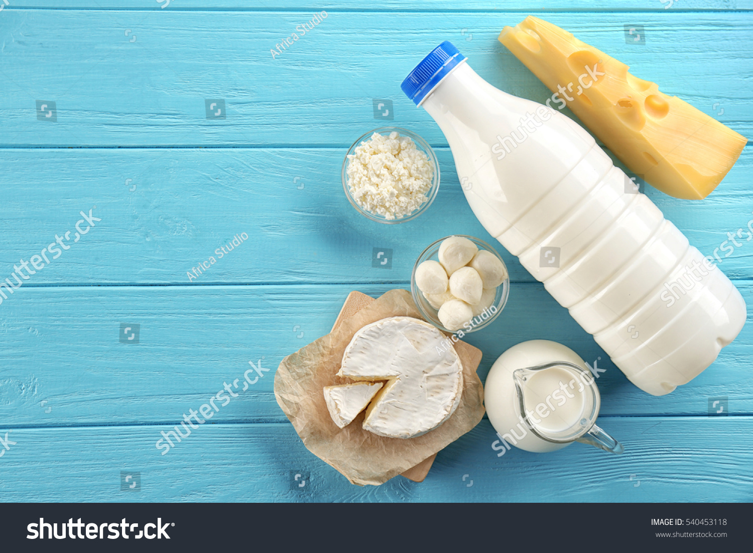Dairy products on wooden background, top view #540453118
