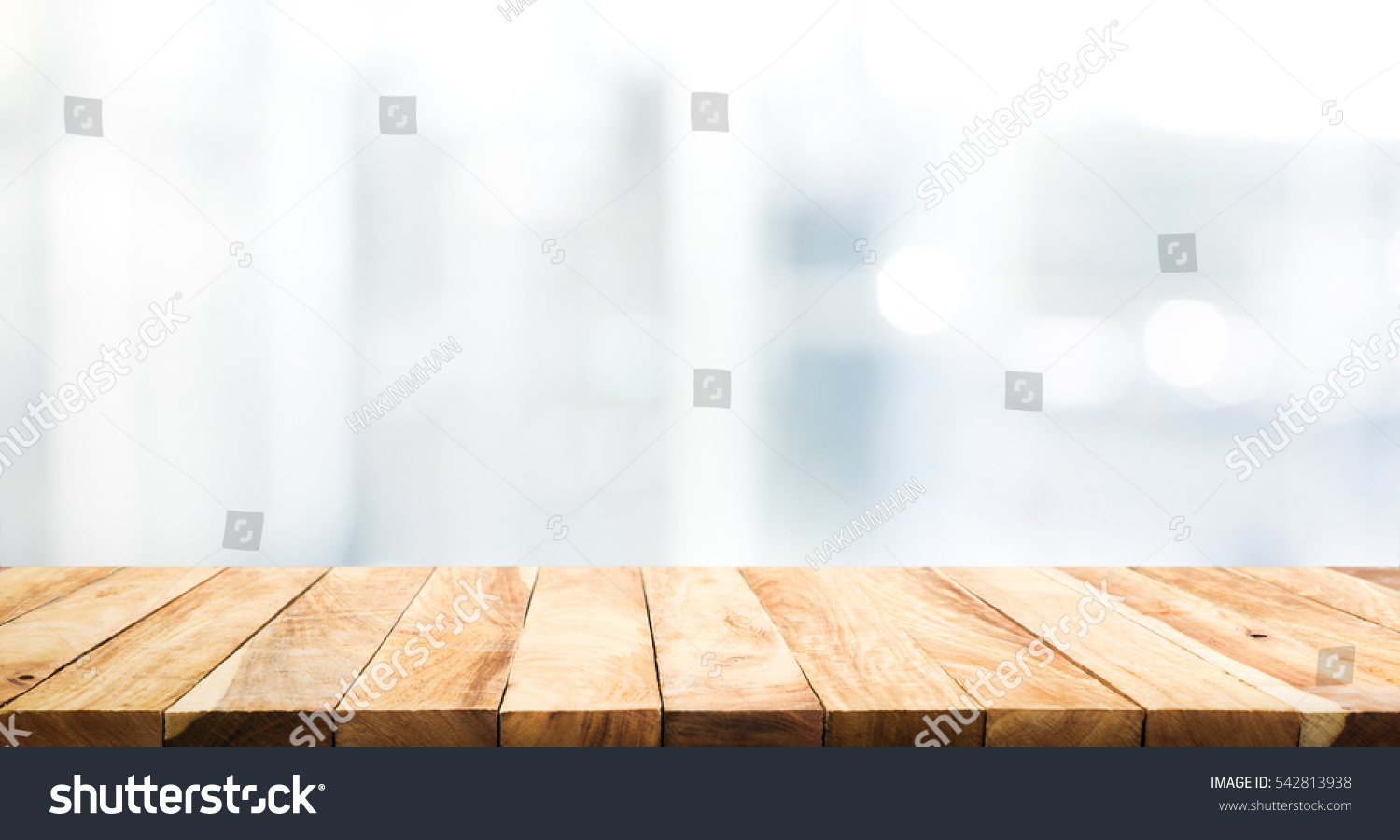 Wood table top on blur glass window wall building background.For montage product display or design key visual layout background. #542813938