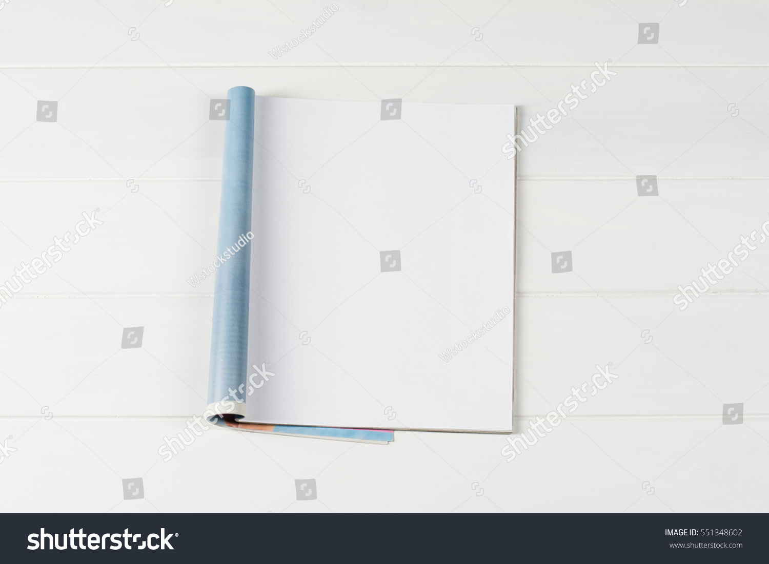 Mock-up magazine or catalog on wooden table. Blank page or notepad on wood background. Blank page or notepad for mockups or simulations. #551348602