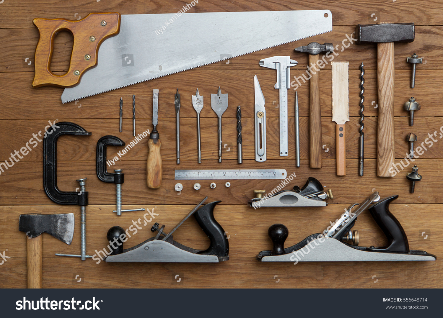 assorted tools for carpenter on wood background #556648714
