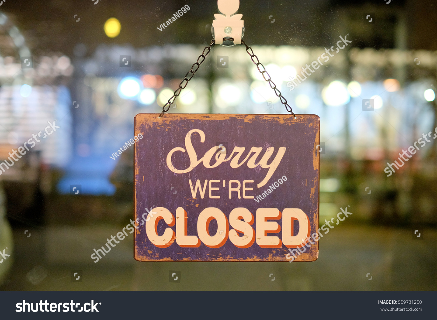 Sorry sign hang on mirror of shop #559731250