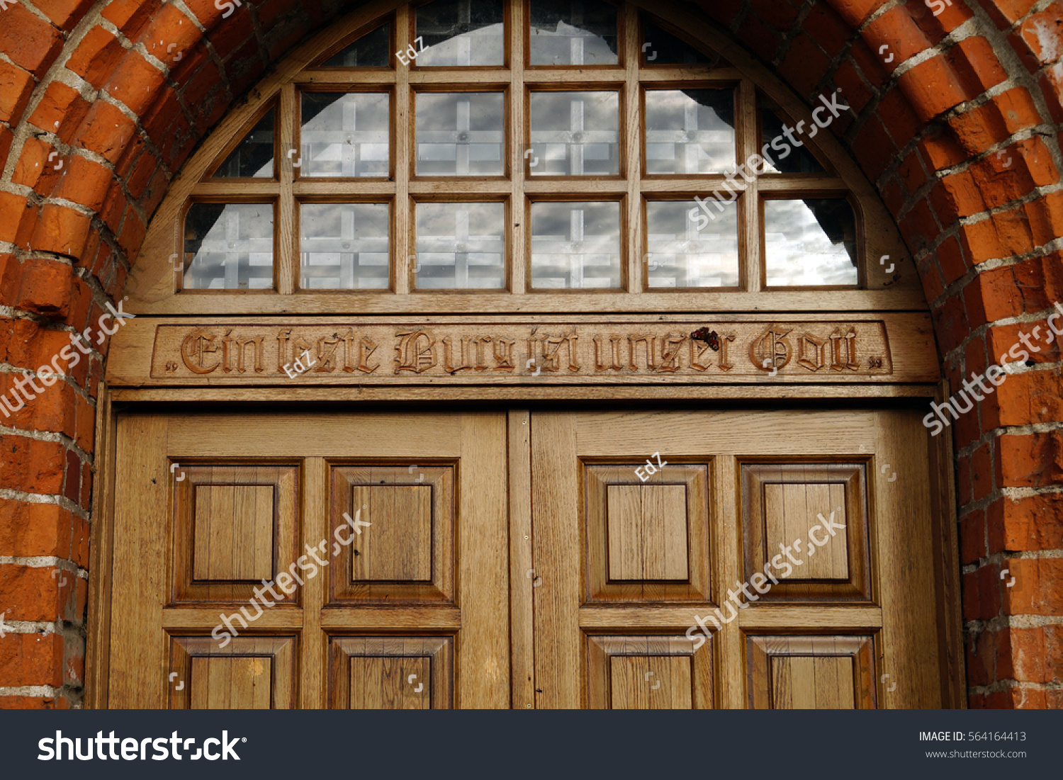Inscription over door of order of Church: "Our God — bulwark" (Ein feste Burg ist unser Gott) #564164413