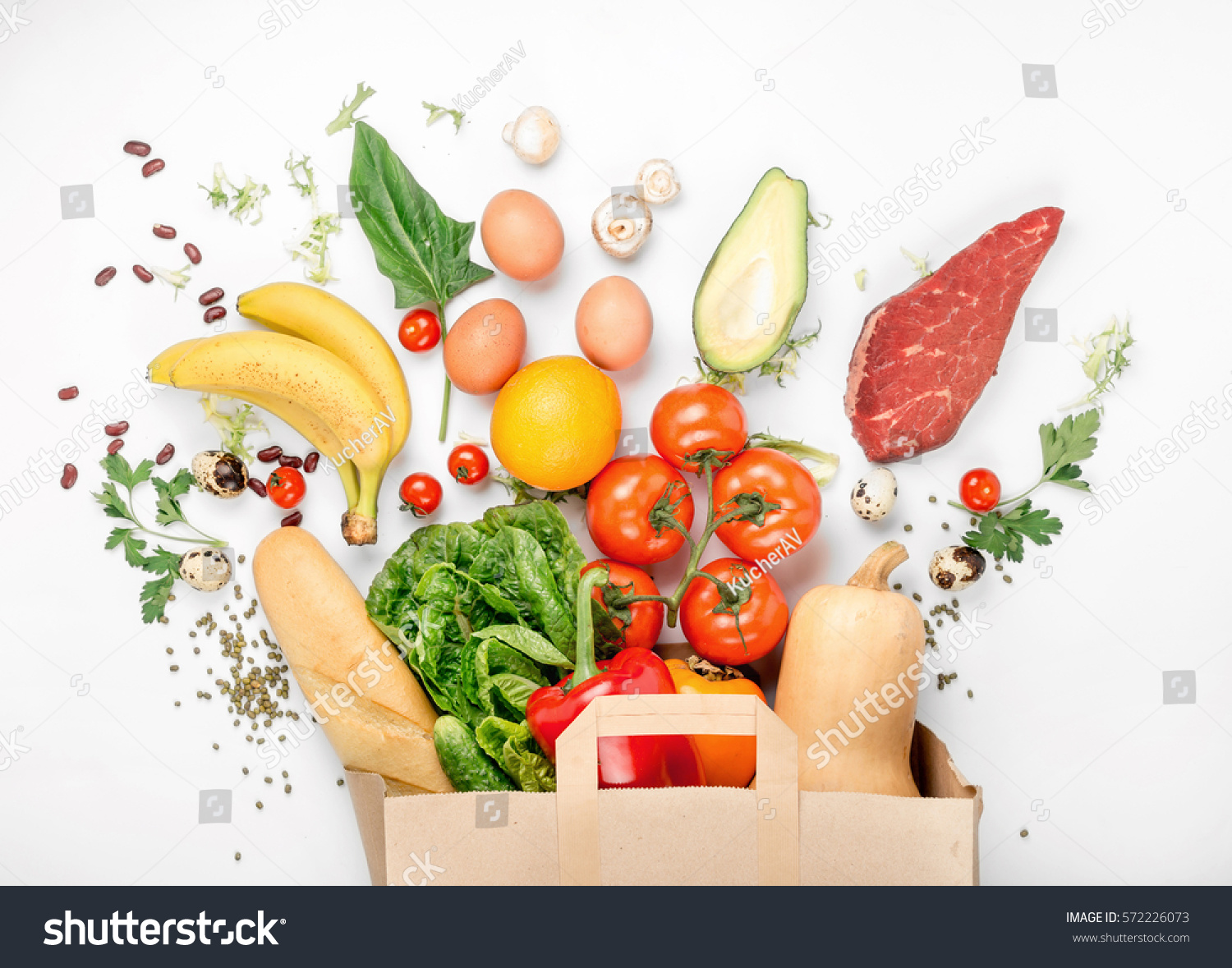 Full paper bag of different health food on a white background. Top view. Flat lay #572226073
