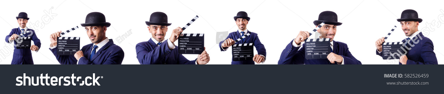 Man with movie clapper isolated on white #582526459