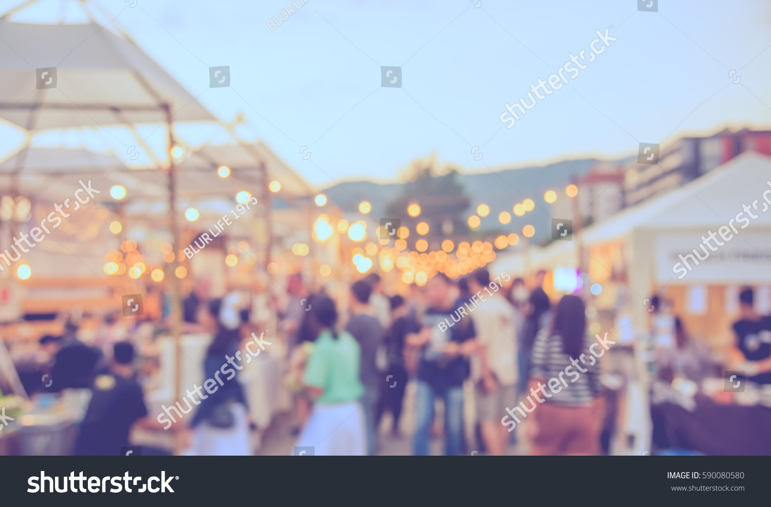 abstract blur image of food stall at day festival for background usage . (vintage tone) #590080580
