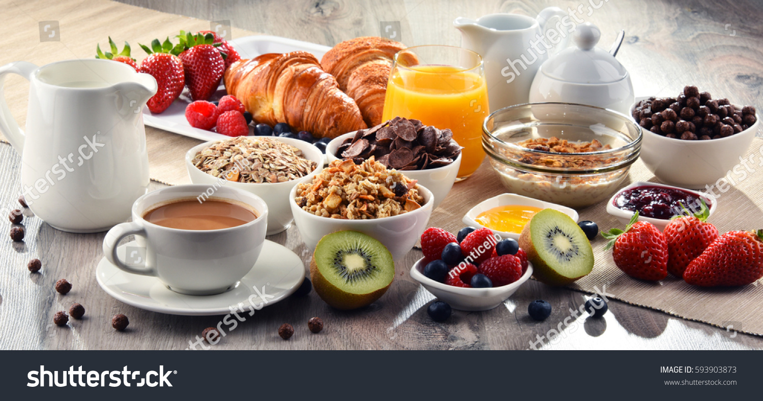 Breakfast served with coffee, orange juice, croissants, cereals and fruits. Balanced diet. #593903873