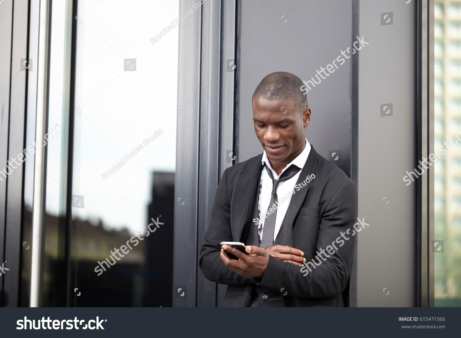 young african american businessman using smart phone #615471566
