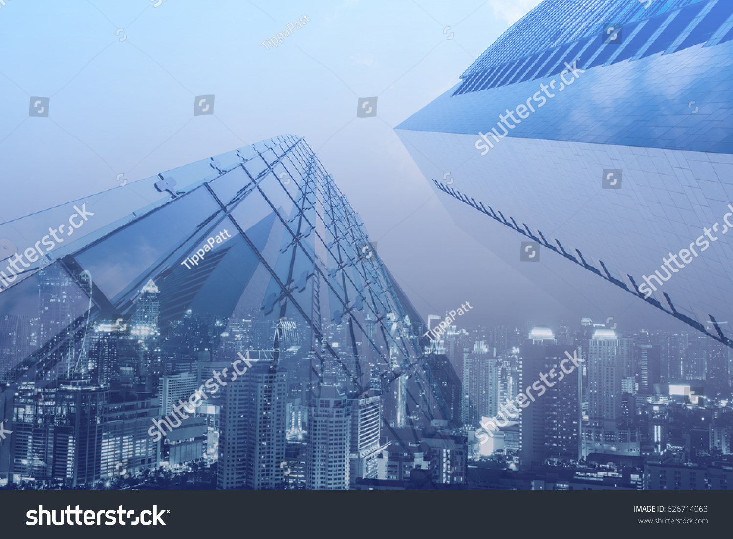 Double exposure, luxury modern highrise buildings and the city can use for business and finance background, blue tone #626714063
