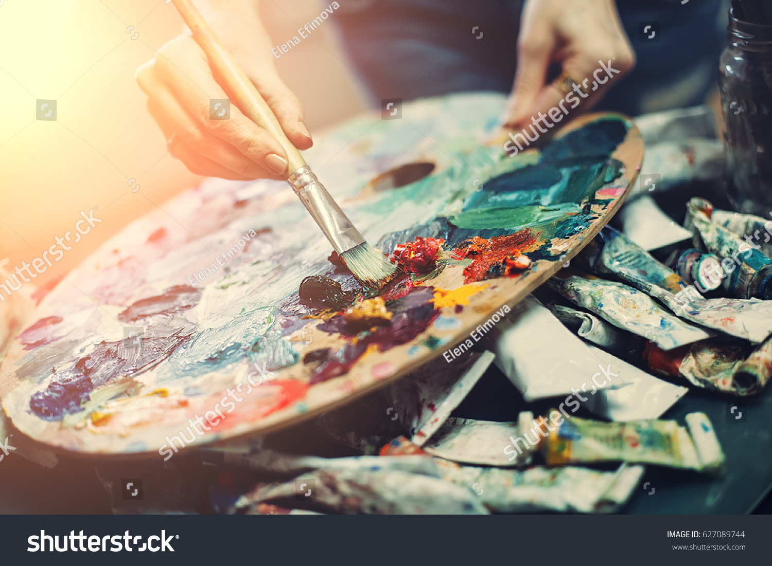 Artist's palette, close-up. Selective focus on the foreground. Background image. #627089744
