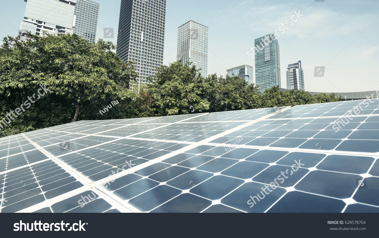 Solar panels and urban construction background #628578704