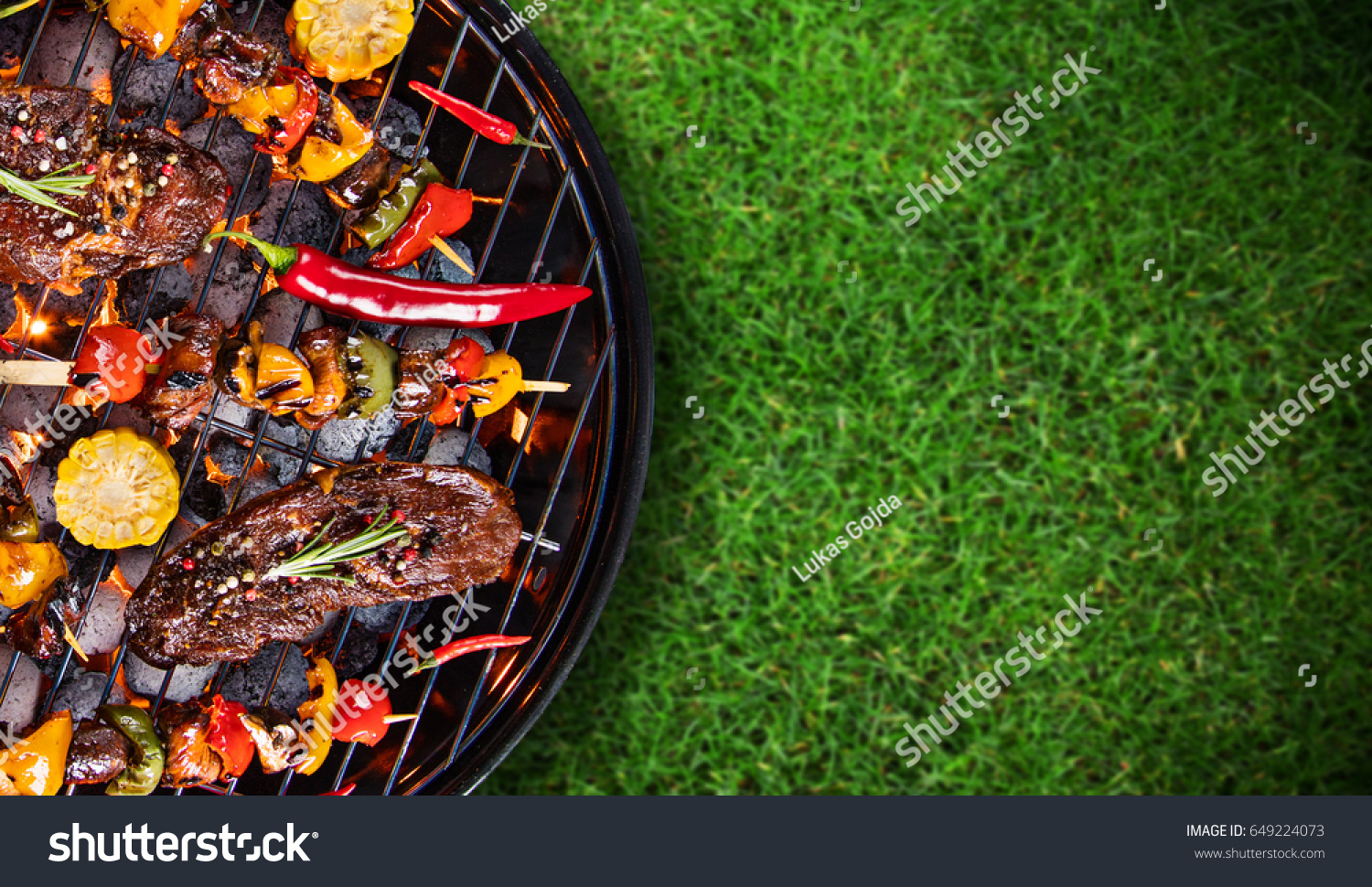 Barbecue garden grill with beef steaks, close-up. #649224073