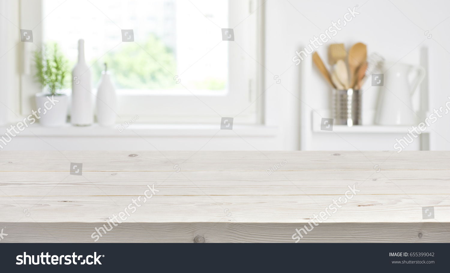 Wooden table on blurred background of kitchen window and shelves #655399042