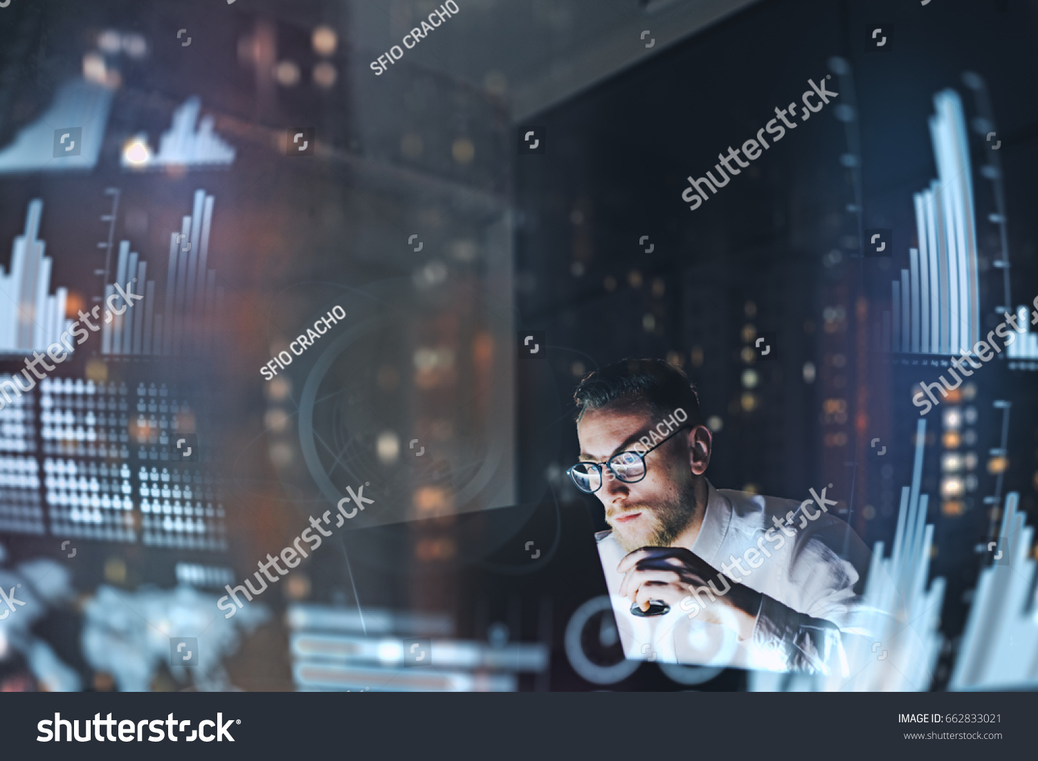 Concept of digital diagram,graph interfaces,virtual screen,connections icon.Young finance analist working at modern office.Man using contemporary laptop at night,blurred background.Horizontal #662833021