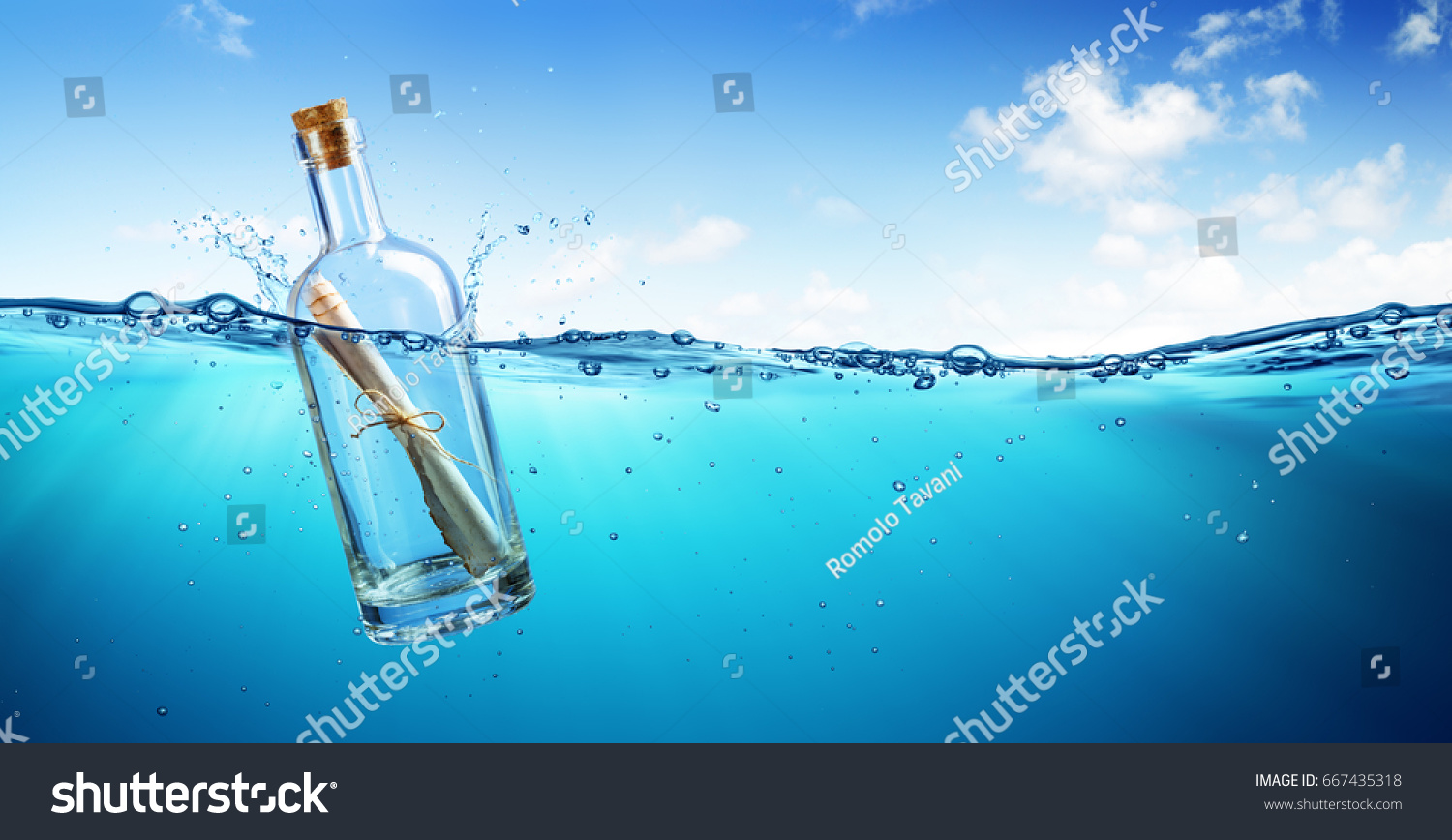 Message In Bottle floating In The Ocean
 #667435318