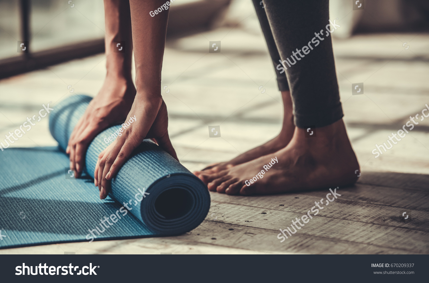 Cropped image of Afro American rolling yoga mat #670209337