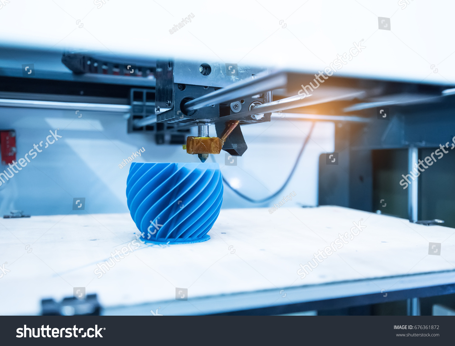 Modern 3D printer printing figure close-up macro #676361872