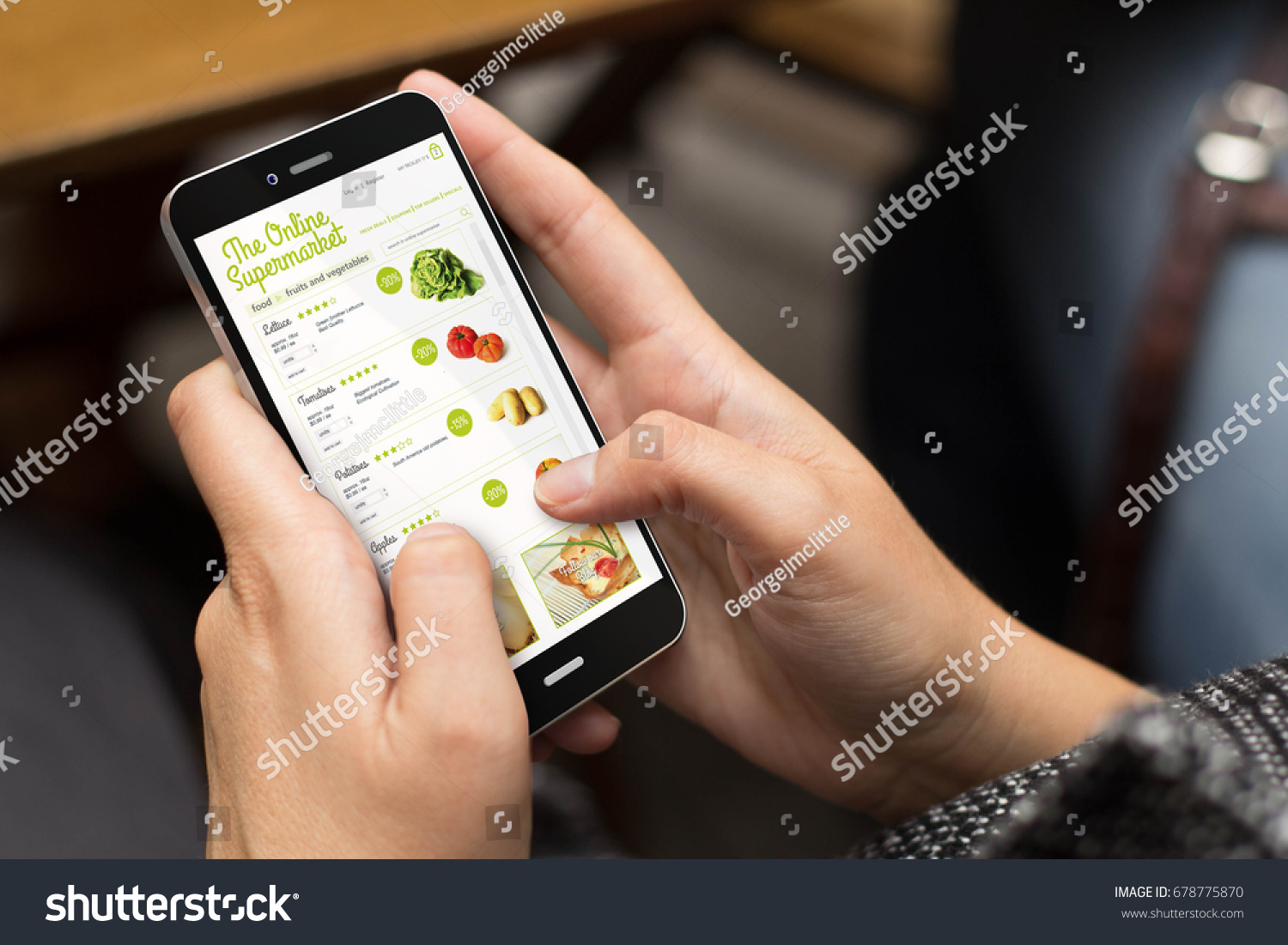 online shopping concept: girl using a digital generated phone with online supermarket on the screen. All screen graphics are made up. #678775870