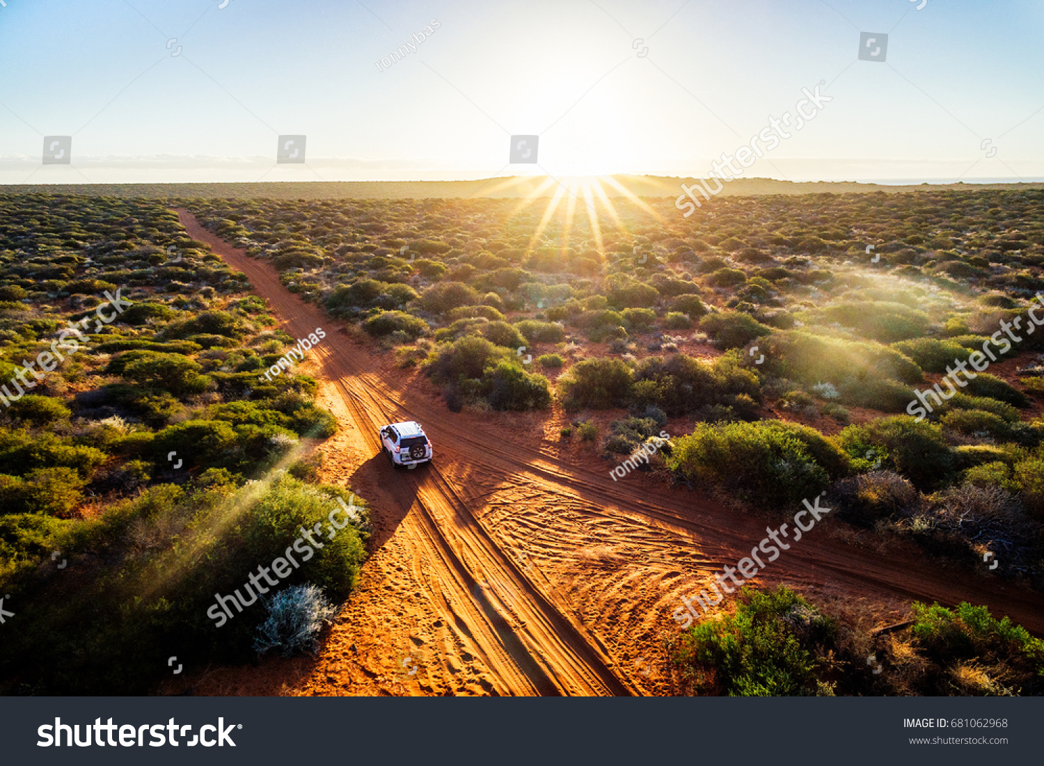 Australia, red sand unpaved road and 4x4 at sunset, Francoise Peron, Shark Bay #681062968