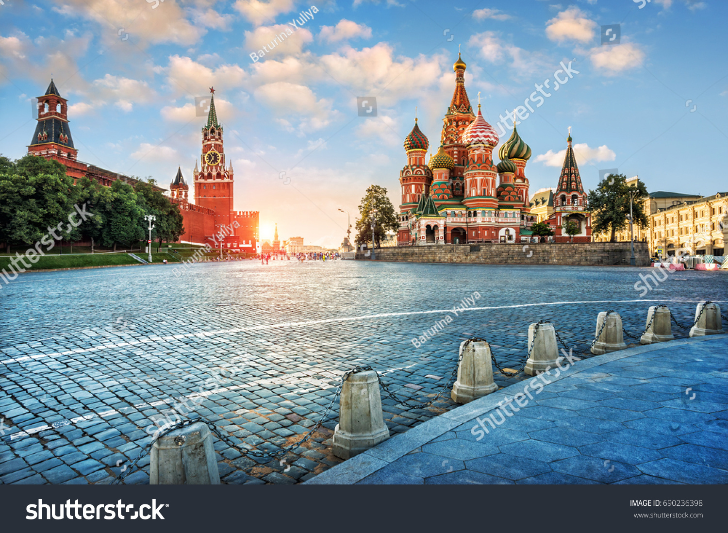 Evening light on Red Square. The St. Basil's Cathedral and the Spassky Tower in the rays of the setting sun. #690236398