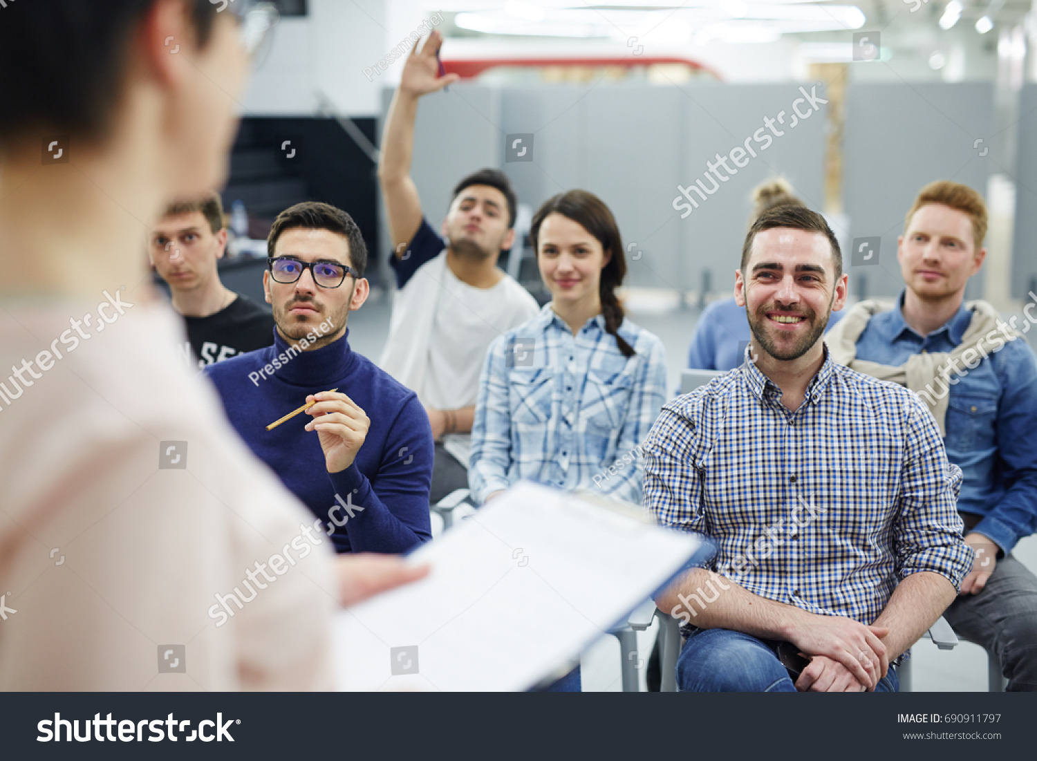 Groupmates listening to lecturer or speaker at conference #690911797