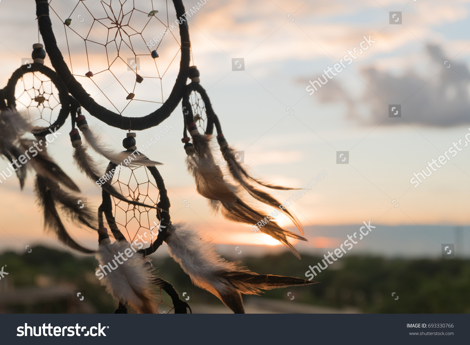 Dream Catcher on the sunset background #693330766