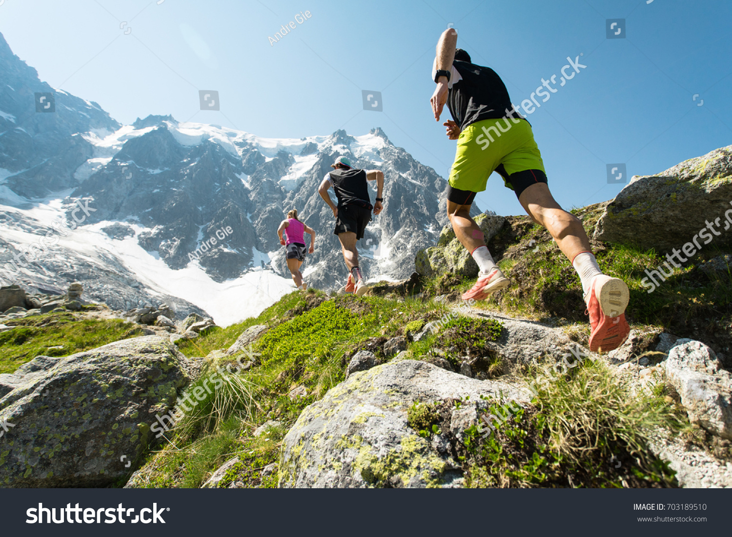 Trail running adventure in the Alps towards the mountains #703189510