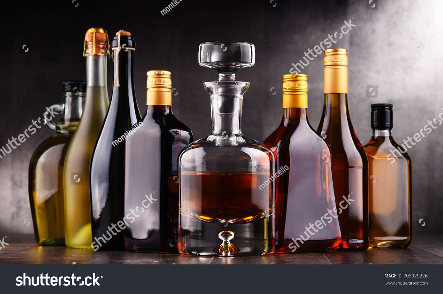 Composition with bottles of assorted alcoholic beverages. #703929226