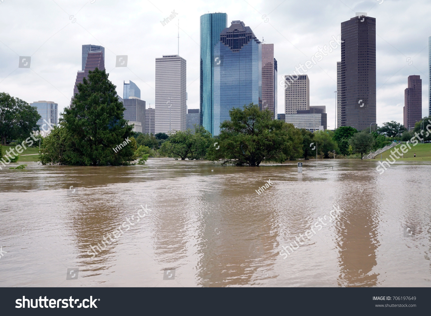 The consequences of the spill Buffalo Bayou River in Houston. Flooded park on Downtown city background. Hurricane Harvey #706197649