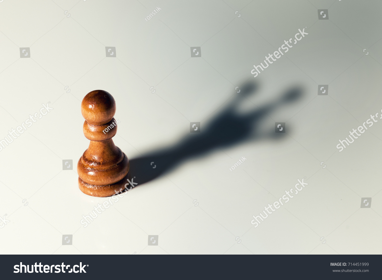 trust yourself, self confident concept - chess pawn with king shadow #714451999