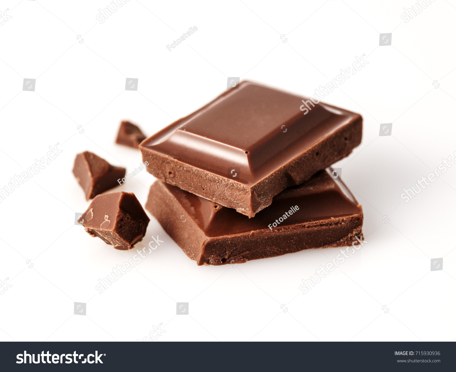 Macro photo  of Chocolate bar. Broken pieces over white background #715930936