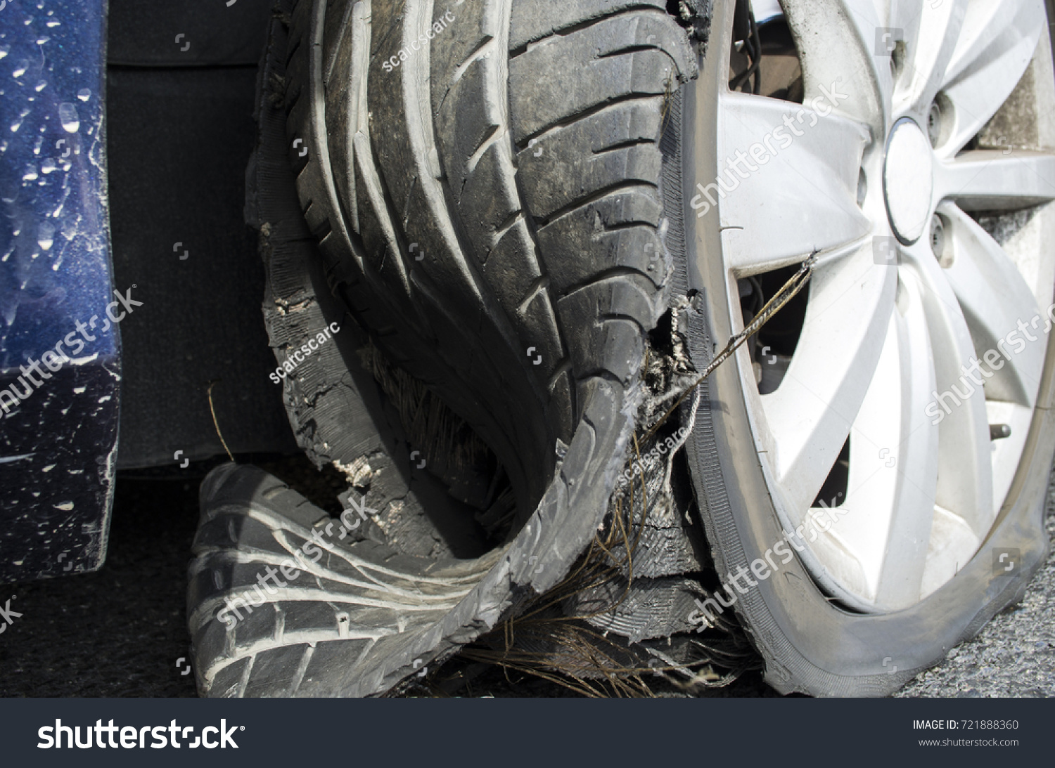 damaged tire after tire explosion at high speed on highway #721888360