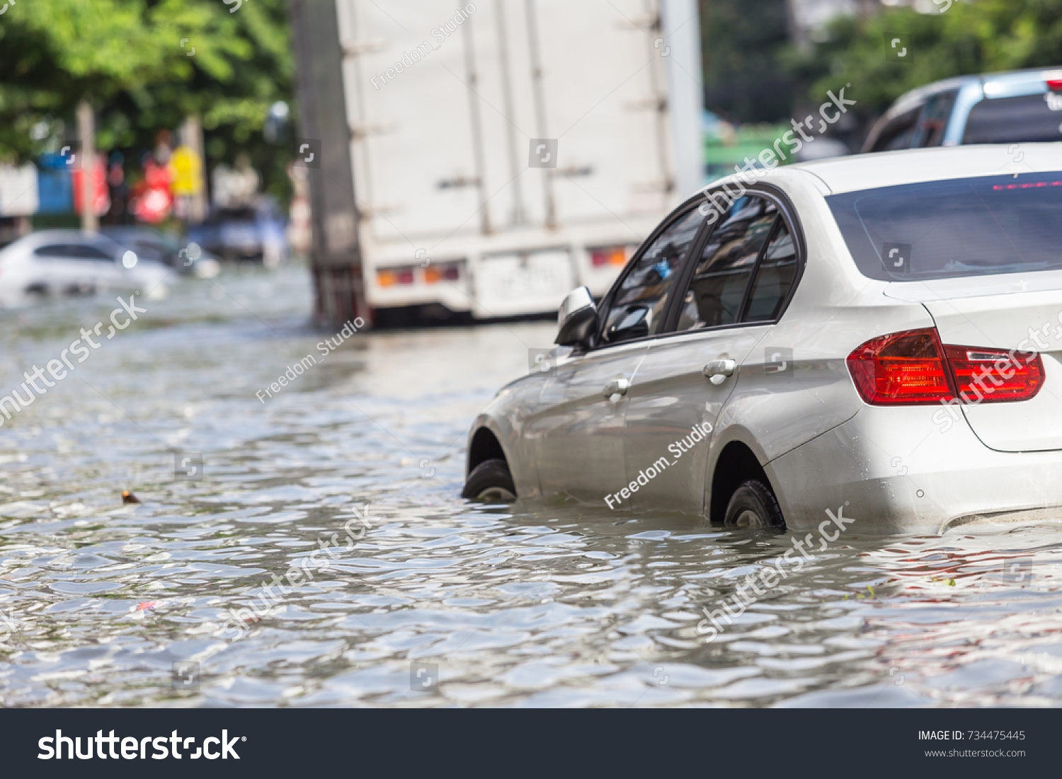 Car parking on the street and show level of water flooding in Bangkok, Thailand #734475445