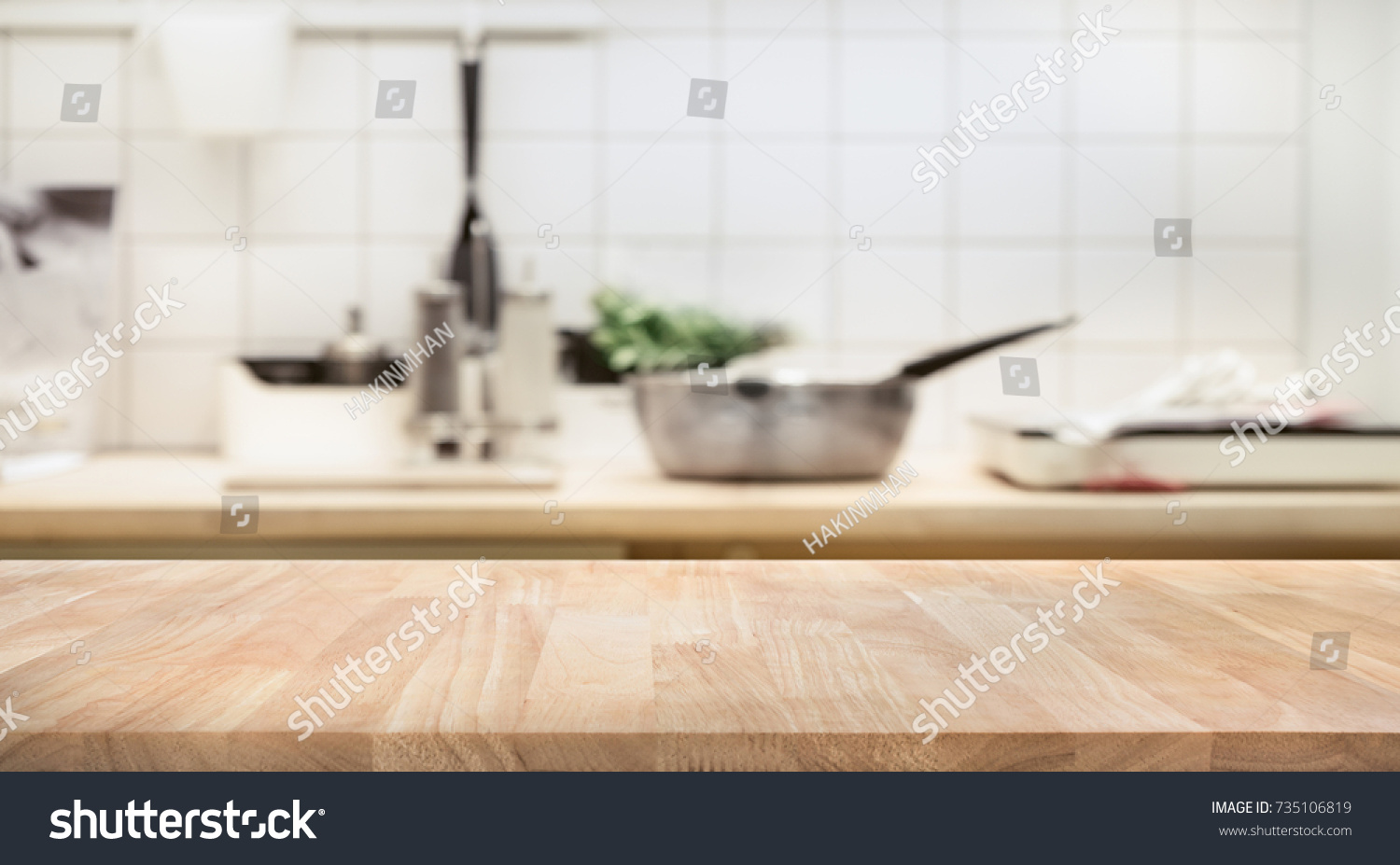 Wood table top on blur kitchen room background .For montage product display or design key visual layout. #735106819