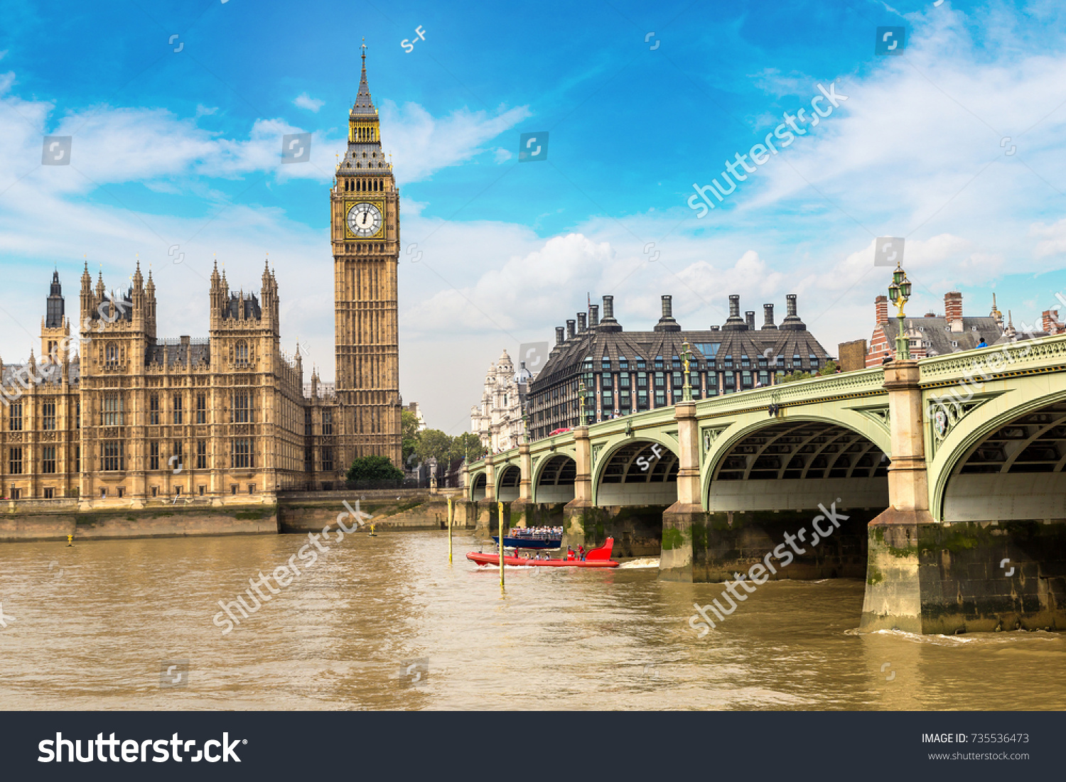The Big Ben, the Houses of Parliament and Westminster bridge in London in a beautiful summer day, England, United Kingdom #735536473