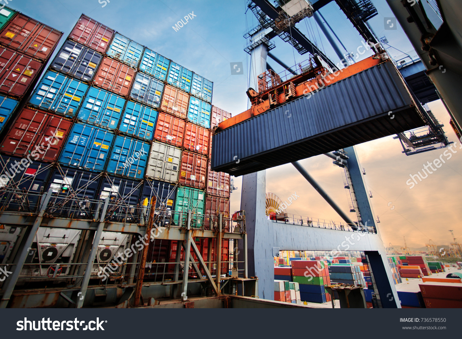 Container loading in a Cargo freight ship with industrial crane. Container ship in import and export business logistic company. Industry and Transportation concept. #736578550