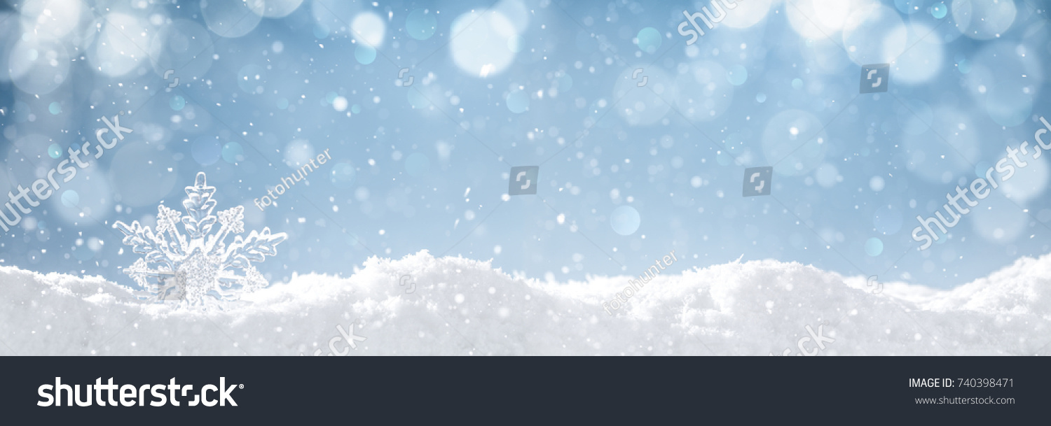 Snowflake on snow.Winter holidays background. #740398471