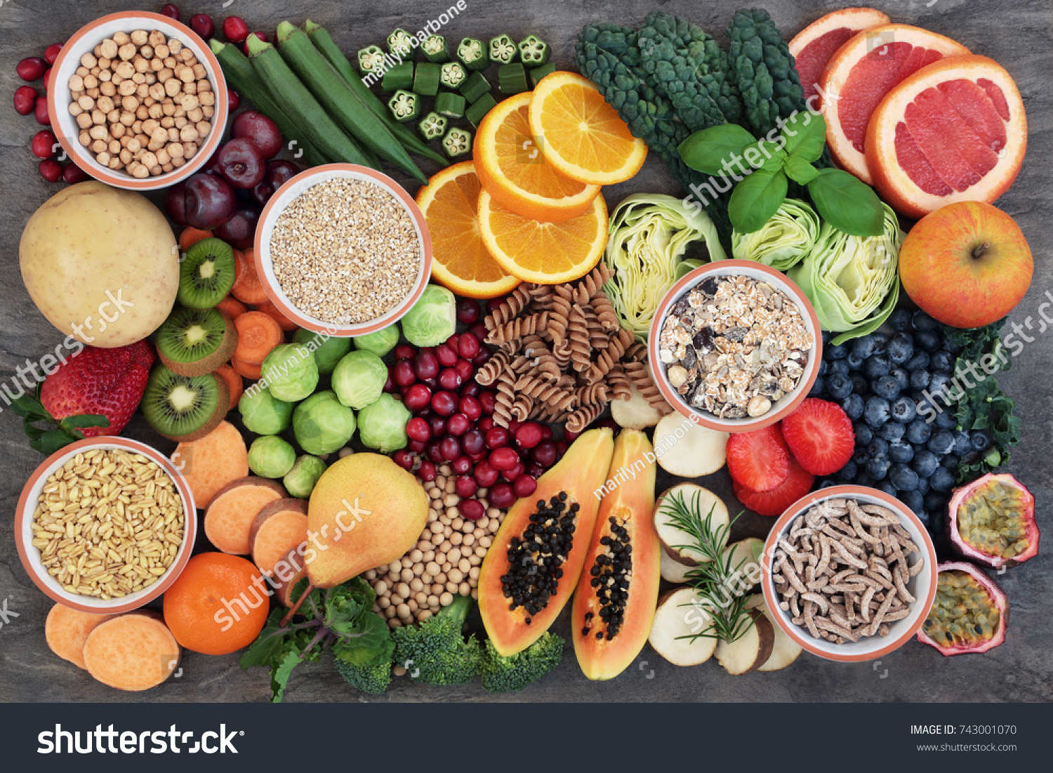Vegan health food concept for  high fibre diet with fruit, vegetables, cereals, whole wheat pasta, grains, legumes, herbs. Foods high in antioxidants  and vitamins. Immune system boosting. Flat lay. #743001070