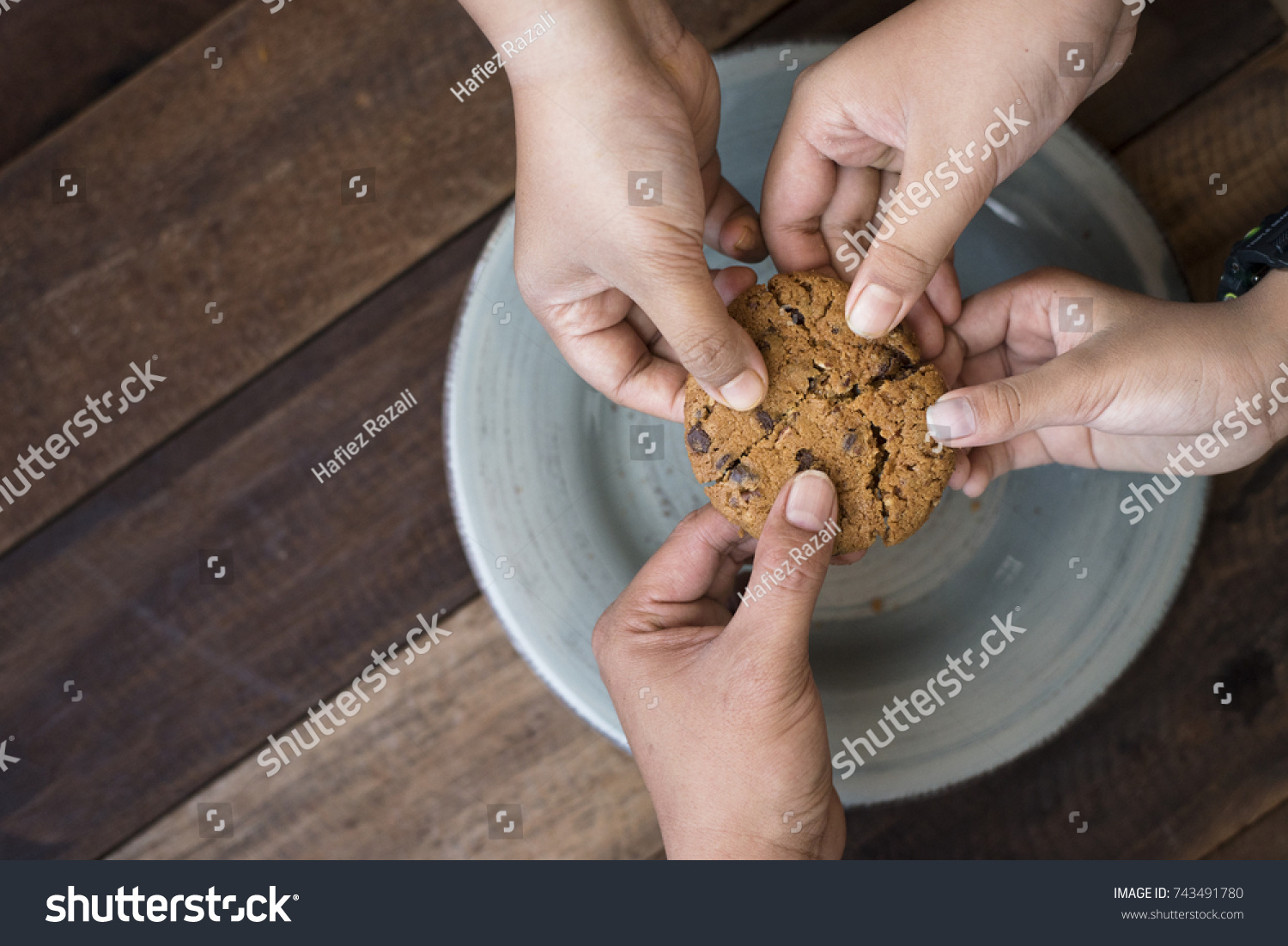 sharing concept - family sharing cookies #743491780