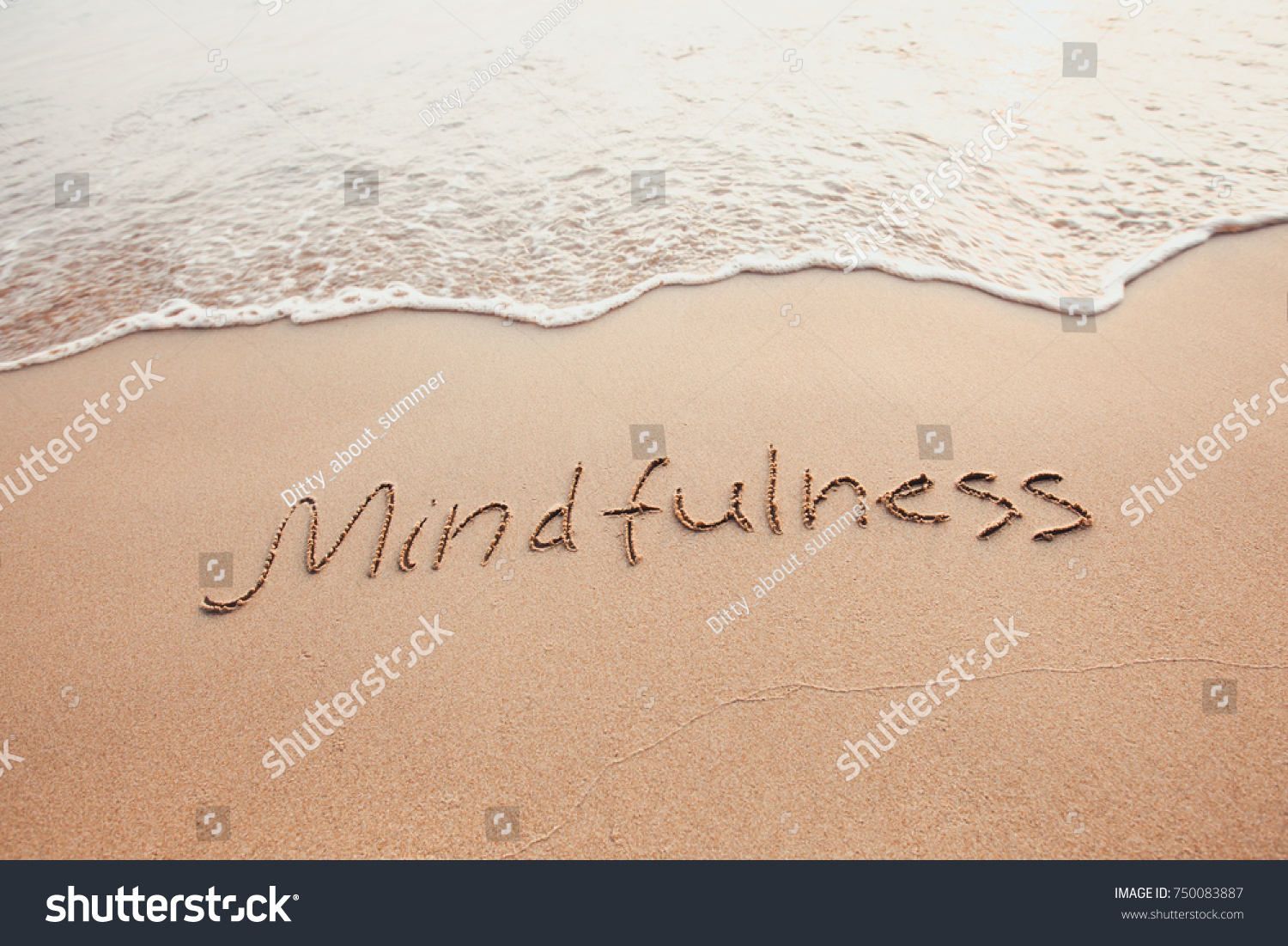 mindfulness concept, mindful living, text written on the sand of beach #750083887