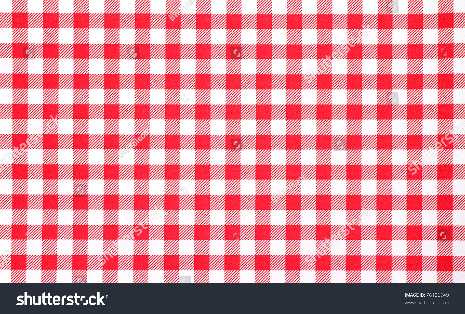 A very close view of a red and white checkerboard tablecloth. #76126549