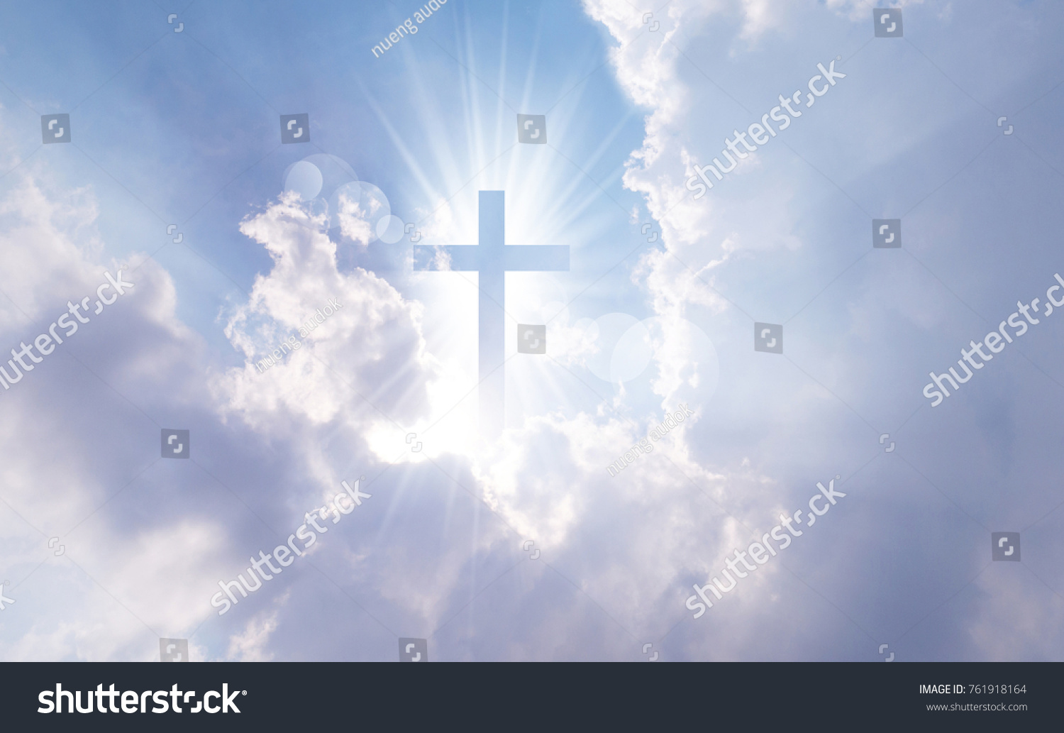 Christian cross appears bright in the sky background #761918164
