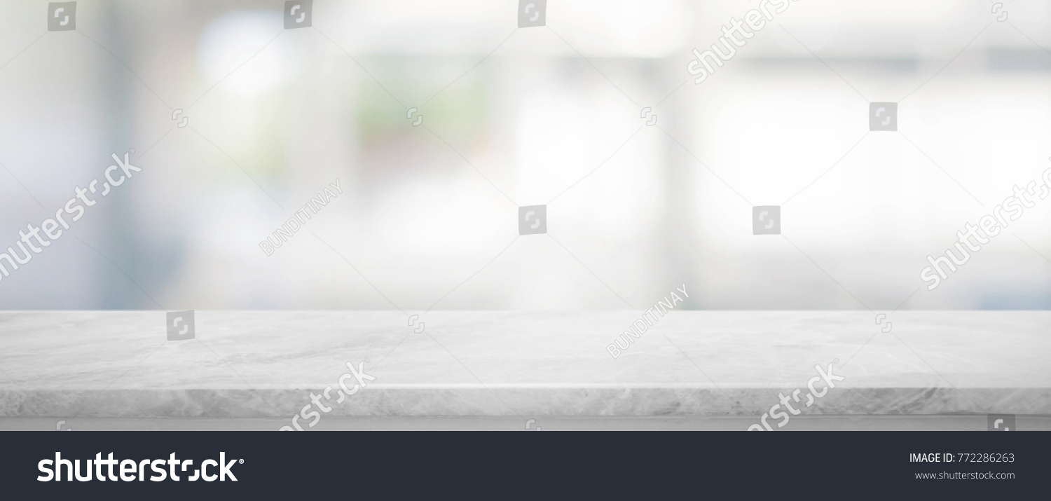 White stone marble table top and blurred abstract background from interior building banner background - can used for display or montage your products. #772286263